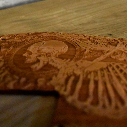 Detailed view of Stumble Skeleton artwork engraved on a wooden pickguard for Epiphone SG Special.