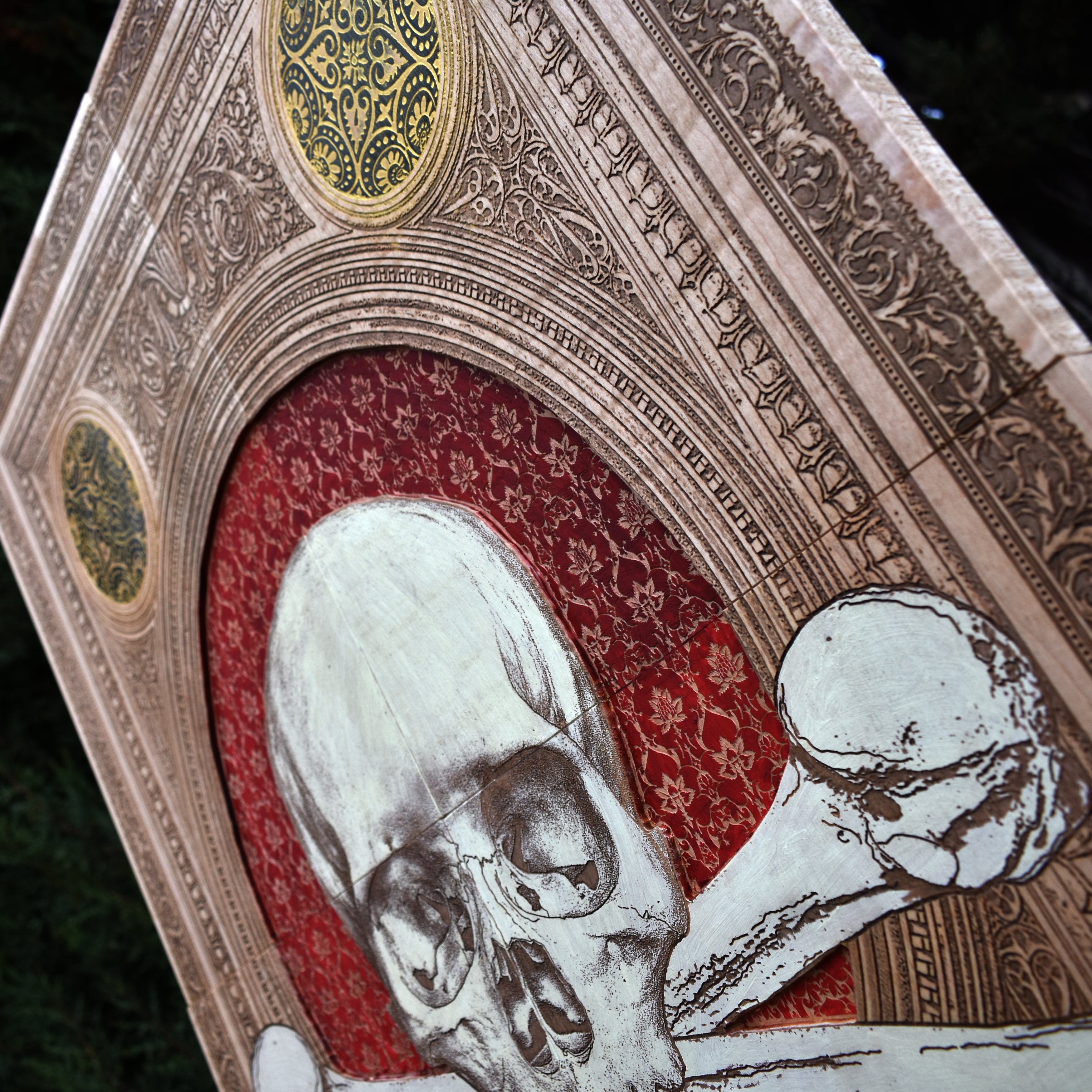 Intricately engraved Memento Mori skull artwork on wood, featuring deep carving. A bold and dramatic gothic wall display for alternative home decor.