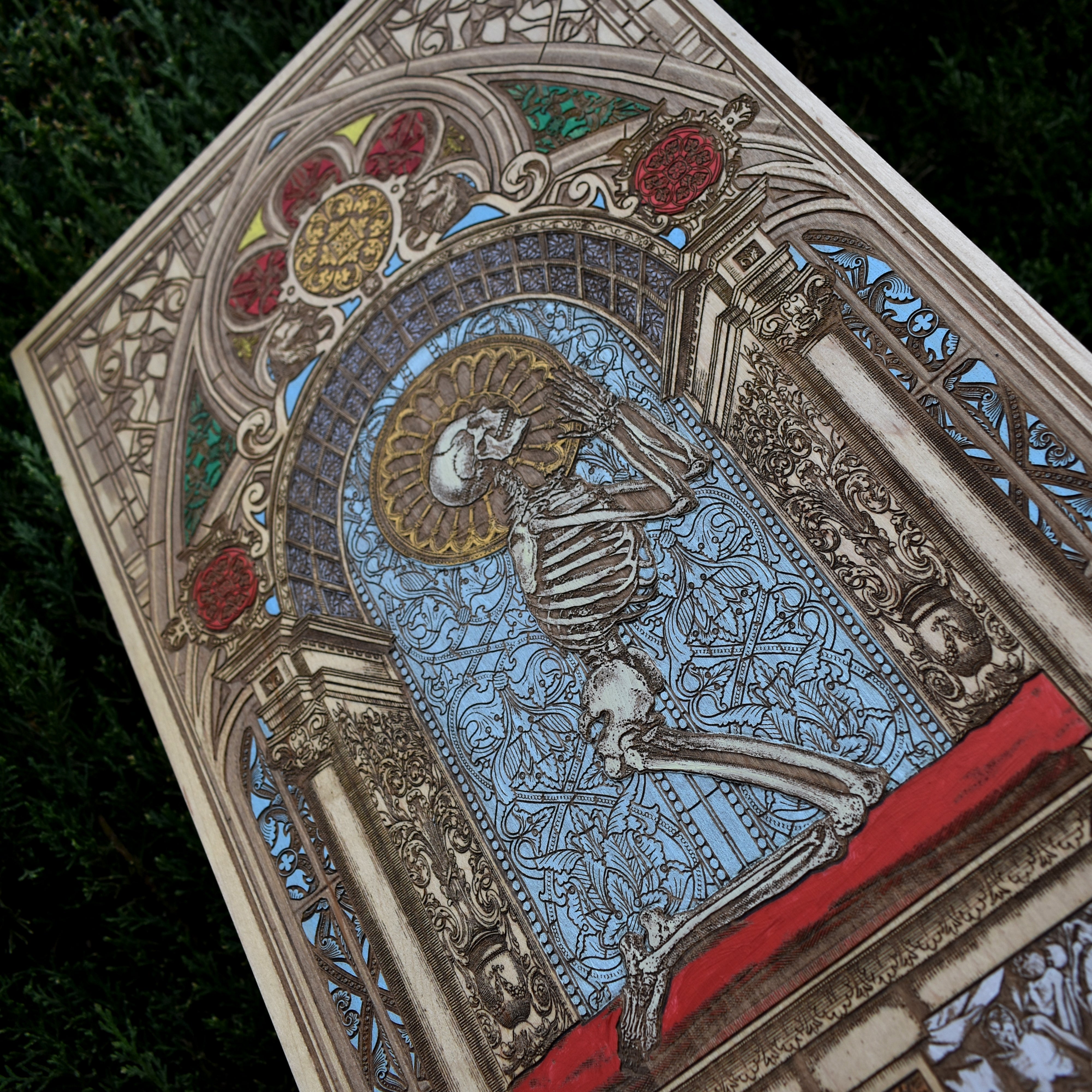 Wooden wall art featuring a hand-painted human skeleton in a prayer pose, with Memento Mori symbolism. Made from solid maple wood, customizable with a name, date, or special message. A meaningful gift.