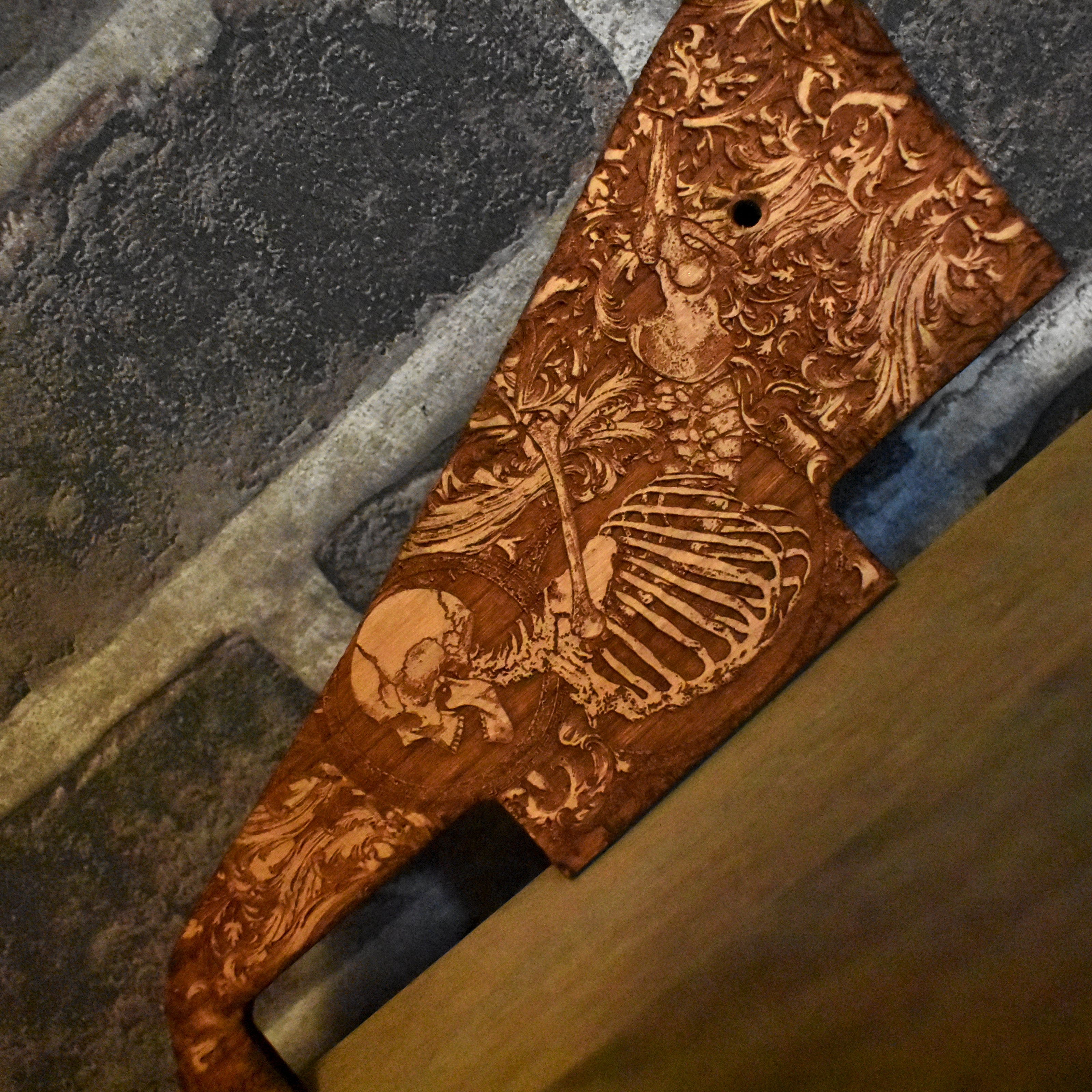 Custom laser-engraved skeleton artwork on a wooden pickguard, an ideal gift for Gibson Les Paul guitar players