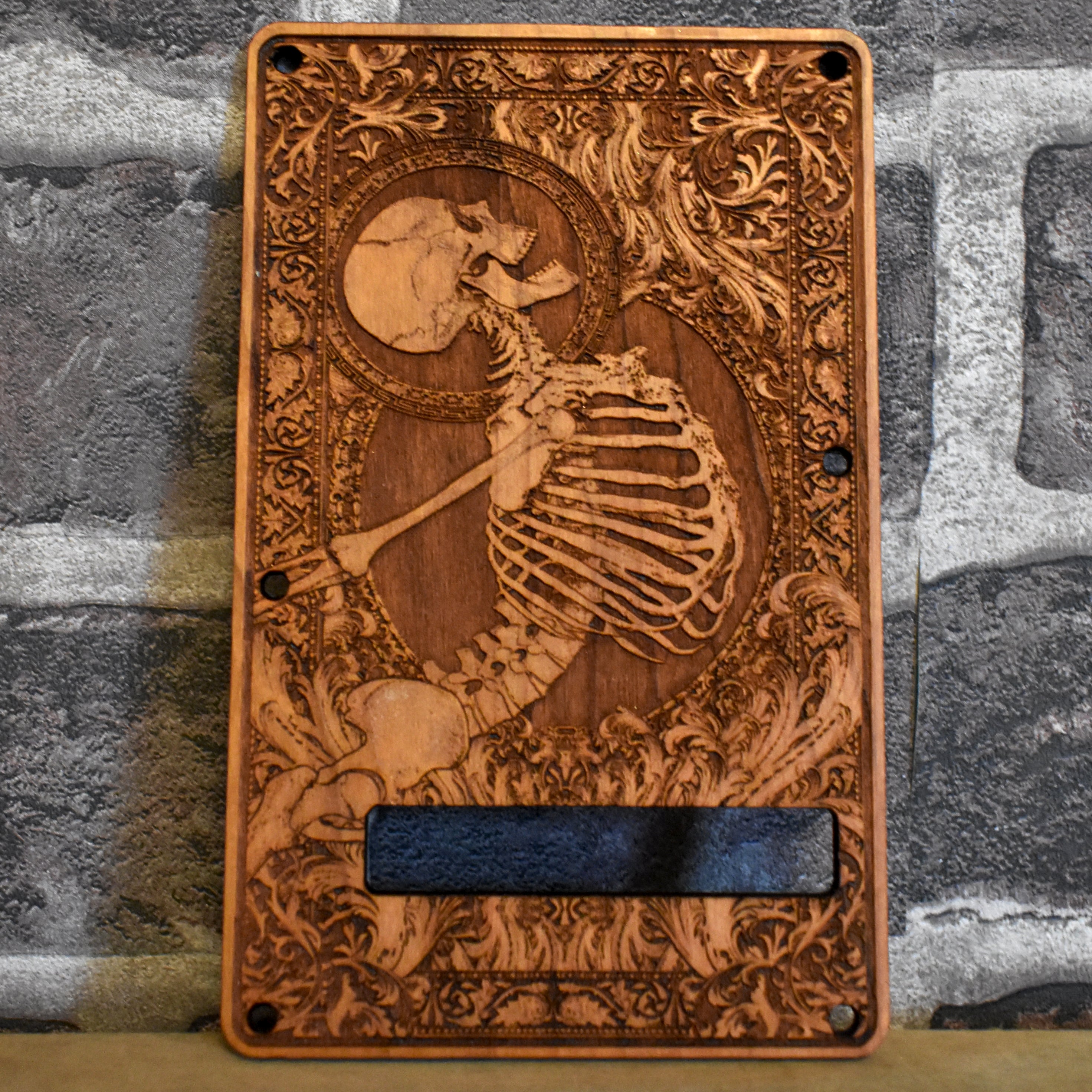 Custom cherry wood tremolo Stratocaster cover with laser-engraved skeleton design