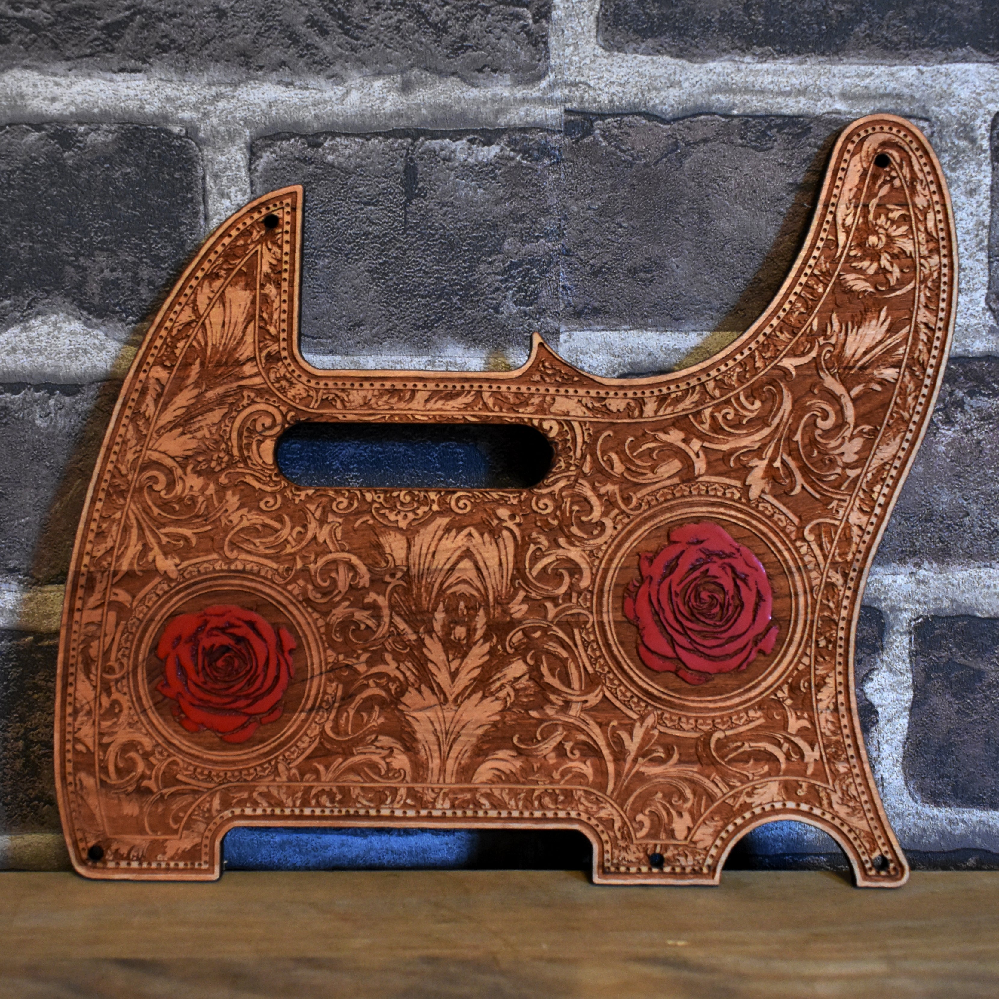 Front view of Fender Telecaster cherry wood pickguard with hand-painted roses design