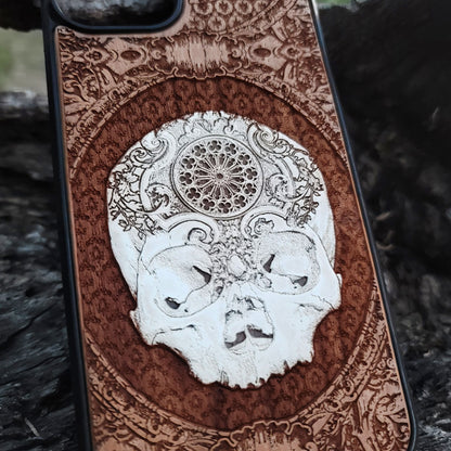 Horror-themed wood phone case with a dark skull engraving, ideal for gothic decor and skull art enthusiasts.