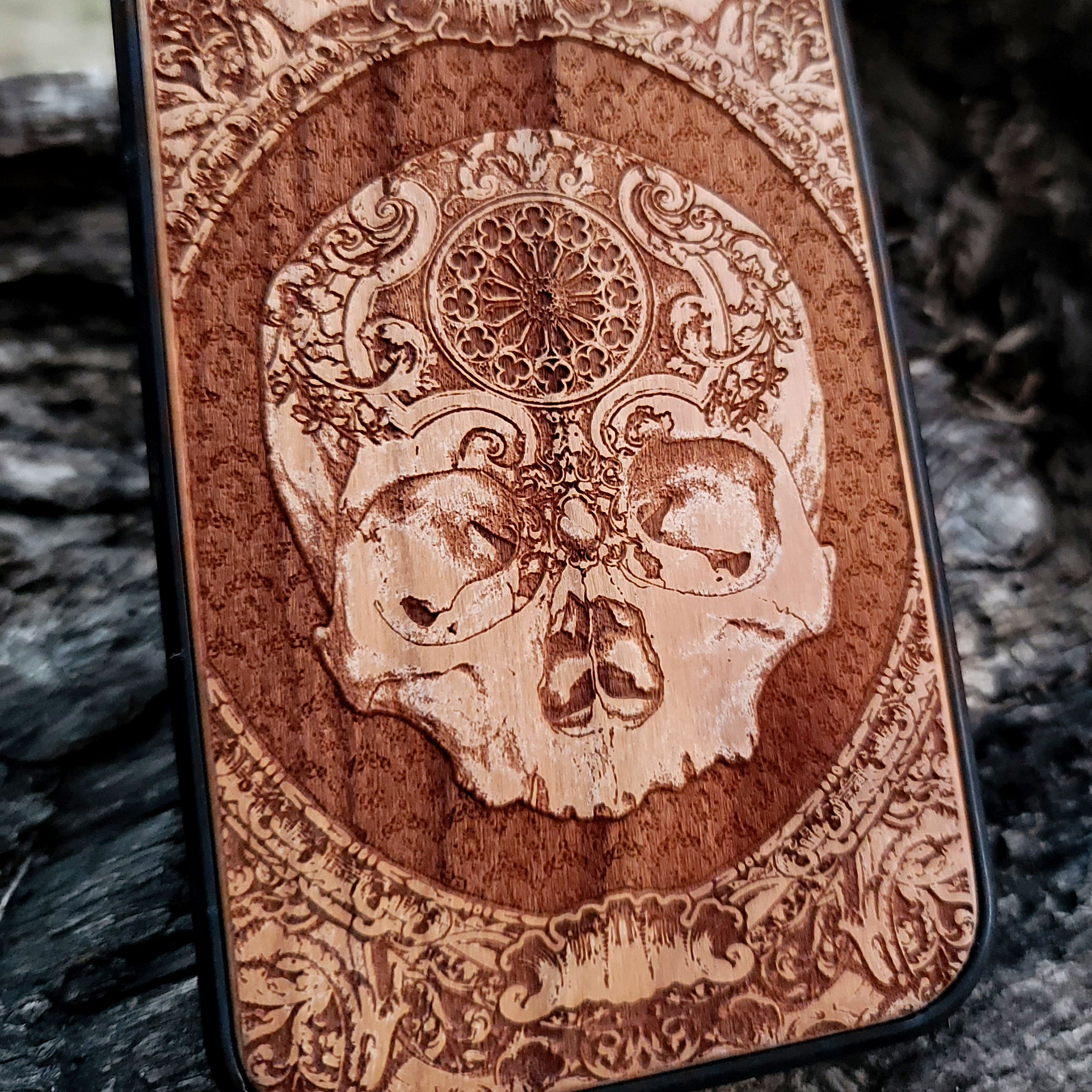 Gothic Skull Engraved Phone Cover – A stunning laser-etched wooden case featuring a dark and detailed skull design, ideal for gothic style lovers.