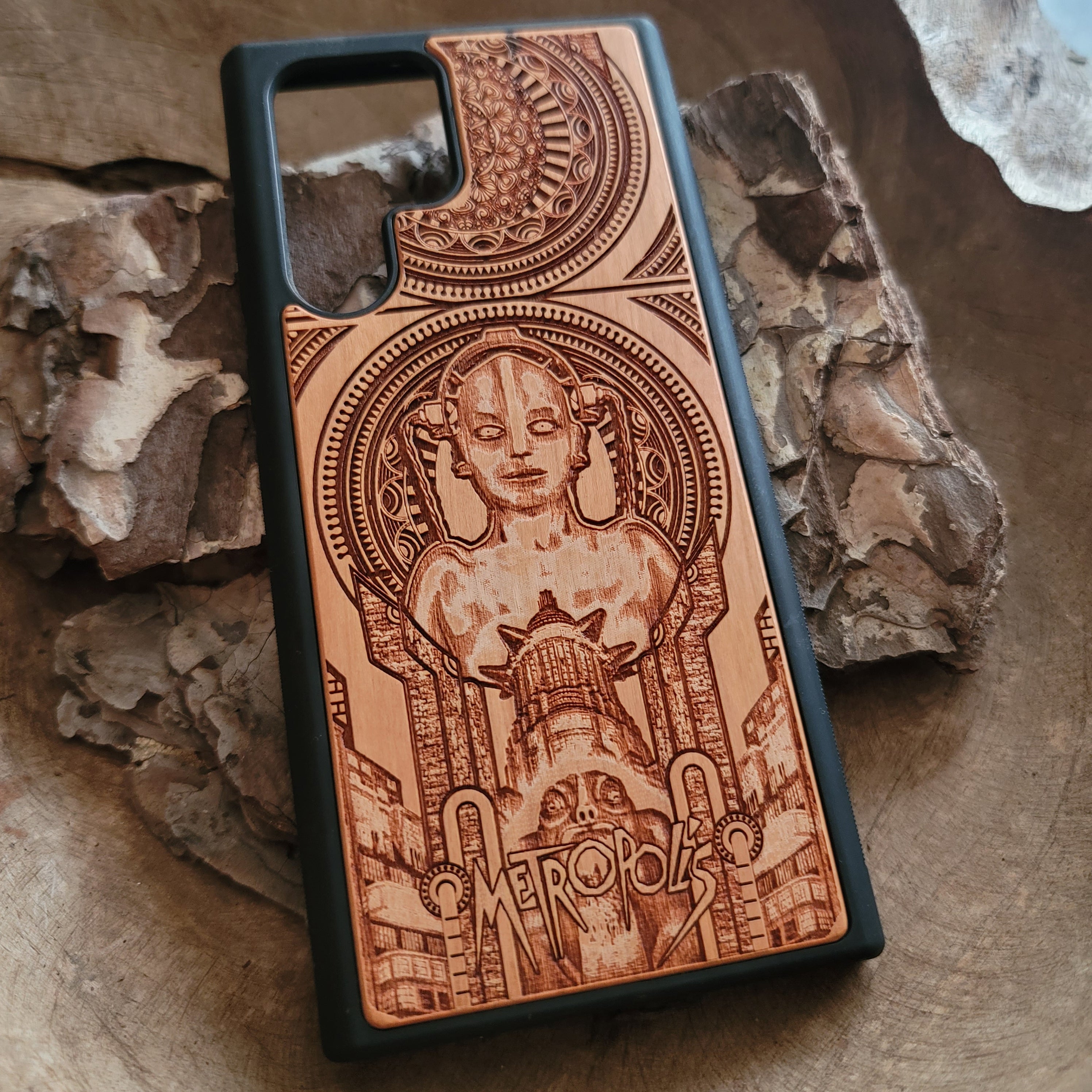 Metropolis wooden phone case with intricate Art Deco design, laser-engraved for iPhone 16, iPhone 15, Galaxy S25, Note 20, and more. A unique accessory for fans of classic films and vintage style.