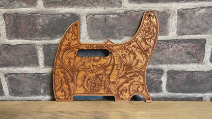 Custom Telecaster pickguard featuring intricate floral engraving on wood