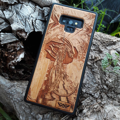 Wooden Xenomorph phone case with intricate HR Giger-inspired design, compatible with iPhone 16, iPhone 15, Galaxy S25, and more. Perfect for Alien movie fans and sci-fi lovers.